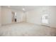 Spacious bedroom with plush carpet, white walls, and an open door to a bathroom or closet at 19 Desert Ivy Ln, Henderson, NV 89011