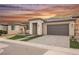 Charming single-story home with a well-manicured lawn, two-car garage, and modern architectural details at 19 Desert Ivy Ln, Henderson, NV 89011