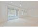 Bright, airy living room featuring large windows and tile floors at 19 Desert Ivy Ln, Henderson, NV 89011
