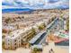 Scenic aerial view of condo community, with palm trees, carports, and a backdrop of mountains at 2044 Mesquite Ln # 202, Laughlin, NV 89029