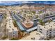 Aerial view of the condo community, featuring palm trees, carports, and mountain views at 2044 Mesquite Ln # 202, Laughlin, NV 89029