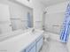 Bathroom featuring a vanity, toilet, and shower with blue patterned shower curtain at 2044 Mesquite Ln # 202, Laughlin, NV 89029