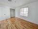 Bedroom boasts hardwood floors and a view of the exterior neighborhood through a window at 2044 Mesquite Ln # 202, Laughlin, NV 89029