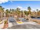 Gated community entrance with palm trees, landscaping, and a view of the community buildings at 2044 Mesquite Ln # 202, Laughlin, NV 89029