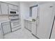 Kitchen featuring white appliances, white cabinets, and white countertops for a clean and bright cooking space at 2044 Mesquite Ln # 202, Laughlin, NV 89029