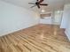 Inviting living room with wood flooring and a ceiling fan, offering a peek into the adjacent kitchen space at 2044 Mesquite Ln # 202, Laughlin, NV 89029