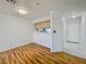 An open living space with wood floors transitions to marble at the front door and a partial view of the kitchen at 2044 Mesquite Ln # 202, Laughlin, NV 89029