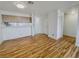 Sunlit living space featuring wood floors, neutral walls, and a glimpse into the adjacent kitchen and hallway at 2044 Mesquite Ln # 202, Laughlin, NV 89029