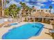 Inviting community pool and spa area with poolside seating and picturesque views of the manicured grounds at 2044 Mesquite Ln # 202, Laughlin, NV 89029