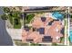 Aerial view of a solar-paneled house showcasing backyard pool, landscaping, and extended outdoor space at 227 Drysdale Cir, Henderson, NV 89074