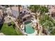Aerial view showcasing a private backyard oasis with a uniquely shaped pool, rock features, and patio area for relaxation at 227 Drysdale Cir, Henderson, NV 89074