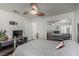Bright bedroom with a ceiling fan, closet with mirrored doors, and a comfortable bed with side tables at 227 Drysdale Cir, Henderson, NV 89074