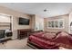 Bedroom with a large bed, desk, TV, shuttered window and closet at 227 Drysdale Cir, Henderson, NV 89074