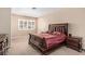 Large bedroom with neutral walls, shuttered window, and a king bed with a decorative headboard at 227 Drysdale Cir, Henderson, NV 89074