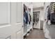 Organized walk-in closet with built-in shelving and hanging rods offering ample storage space at 227 Drysdale Cir, Henderson, NV 89074