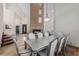 Elegant dining room featuring a fireplace, modern chandelier, and large table with seating for eight at 227 Drysdale Cir, Henderson, NV 89074