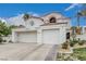 Beautiful two-story home features tile roof, attached two-car garage, and desert landscaping at 227 Drysdale Cir, Henderson, NV 89074