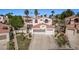 Two-story home featuring manicured lawn, drought resistant landscape, and three-car garage at 227 Drysdale Cir, Henderson, NV 89074