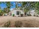Exterior view of home with a large backyard, pool, covered patio and drought resistant landscaping at 227 Drysdale Cir, Henderson, NV 89074