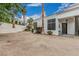 View of the side yard showcasing xeriscaping, and access to the front door at 227 Drysdale Cir, Henderson, NV 89074