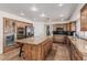 Modern kitchen with a central island, custom cabinets, and stainless steel appliances at 227 Drysdale Cir, Henderson, NV 89074