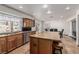 Spacious kitchen with stainless steel appliances, custom wood cabinets, and a large center island at 227 Drysdale Cir, Henderson, NV 89074