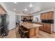 Well-appointed kitchen with a large island, custom cabinets, and stainless steel appliances at 227 Drysdale Cir, Henderson, NV 89074