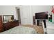 Bedroom with carpet, closet, dresser, TV, decorations, and a glimpse into the bathroom at 230 Carmel Sky St, Las Vegas, NV 89138