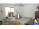 Bright bedroom with carpet, a large window, desk, shelving, dresser, and decorations at 230 Carmel Sky St, Las Vegas, NV 89138