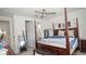 Bedroom with a four-poster bed, ceiling fan, and neutral tones at 230 Carmel Sky St, Las Vegas, NV 89138