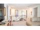 Bright hallway featuring glass railing, neutral decor, and open staircase to lower level at 230 Carmel Sky St, Las Vegas, NV 89138