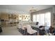 Bright living room with white furniture, open concept, and large windows offering lots of light at 230 Carmel Sky St, Las Vegas, NV 89138