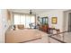 Upstairs living room featuring a comfortable sectional sofa, exercise equipment, and stylish decor at 230 Carmel Sky St, Las Vegas, NV 89138