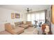Upstairs living room with a comfortable sectional sofa, exercise equipment, and bright natural light at 230 Carmel Sky St, Las Vegas, NV 89138