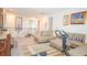 Spacious living area featuring a comfortable sofa, exercise equipment, and bright natural light at 230 Carmel Sky St, Las Vegas, NV 89138