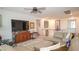 Open-concept living room with an exercise bike, comfortable sofa, and stylish decor on the upper floor at 230 Carmel Sky St, Las Vegas, NV 89138