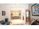 Elegant living space showcasing an open floor plan, artwork, and bright, neutral tile floors at 230 Carmel Sky St, Las Vegas, NV 89138