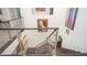 Elegant staircase with glass railings, showcasing modern design and seamless transition to the upper level at 230 Carmel Sky St, Las Vegas, NV 89138