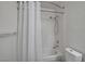 Bathroom featuring a shower-tub combination, toilet, and shower curtain at 2504 Soldier Creek Ct, Las Vegas, NV 89106