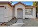 Inviting front entrance featuring an arched doorway and a secure decorative security door at 2504 Soldier Creek Ct, Las Vegas, NV 89106