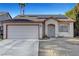 Charming single-story home featuring desert landscaping, solar panels, and a two-car garage at 2504 Soldier Creek Ct, Las Vegas, NV 89106