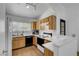 Efficient kitchen boasts wooden cabinets, a window, and modern appliances at 2504 Soldier Creek Ct, Las Vegas, NV 89106