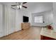 Bright living room featuring wood floors, white walls, and ample natural light at 2504 Soldier Creek Ct, Las Vegas, NV 89106
