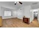 Bright living room featuring wood floors, white walls, and ample natural light at 2504 Soldier Creek Ct, Las Vegas, NV 89106