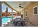 Relaxing covered patio with outdoor seating, adjacent to a sparkling pool, great for entertaining at 266 Cordero Dr, Henderson, NV 89074