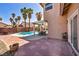 Covered patio adjacent to a sparkling pool, providing a perfect blend of relaxation and entertainment at 266 Cordero Dr, Henderson, NV 89074