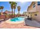 Charming backyard features a refreshing pool, shaded patio, and ample seating for outdoor gatherings at 266 Cordero Dr, Henderson, NV 89074