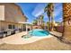 Inviting backyard features a sparkling pool and spa, perfect for relaxation and outdoor enjoyment at 266 Cordero Dr, Henderson, NV 89074