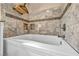 Modern bathtub with decorative tile surround, alcove and chrome fixtures, perfect for relaxation at 266 Cordero Dr, Henderson, NV 89074