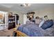 Bedroom with a wooden bed, carpeted floors, a window, and dark colored bedding at 266 Cordero Dr, Henderson, NV 89074